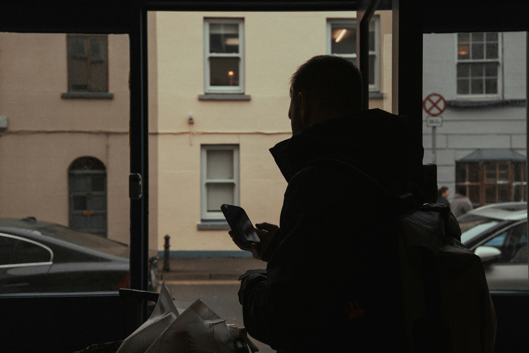 Someone checking their phone on a city street